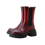 Dark red platform boots with black elastic side panels and thick lug-sole heel
