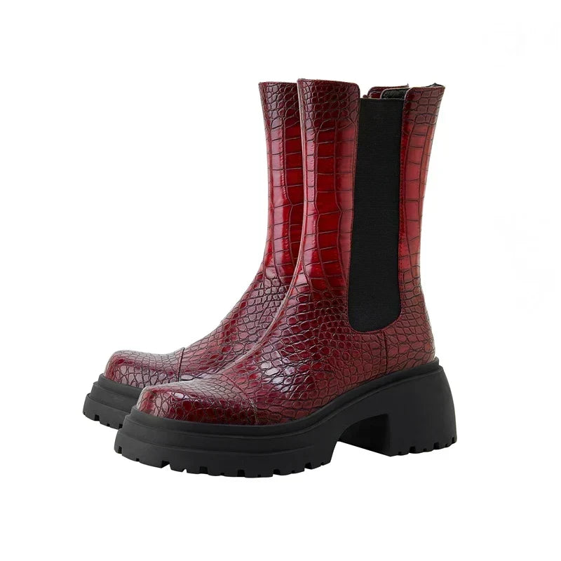 Dark red platform boots with black elastic side panels and thick lug-sole heel