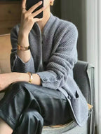 Gray textured knit jacket with button front and stand collar, long sleeves