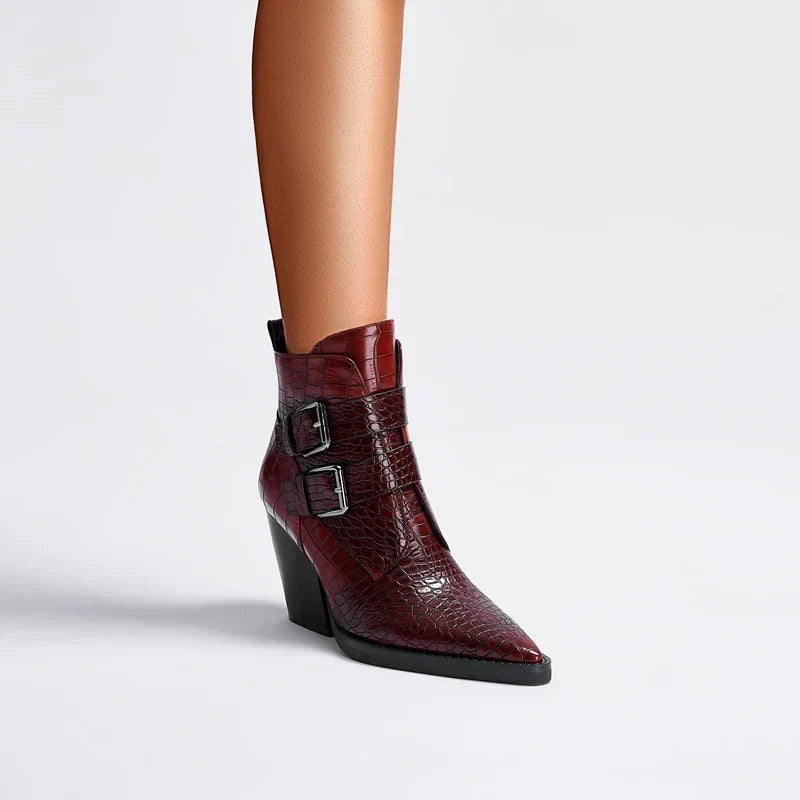 Women’s pointed-toe ankle boots in dark red with buckle strap closures