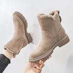 Beige women’s round-toe ankle boots with side zipper, fuzzy lining, and tread sole