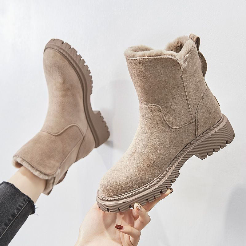 Beige women’s round-toe ankle boots with side zipper, fuzzy lining, and tread sole