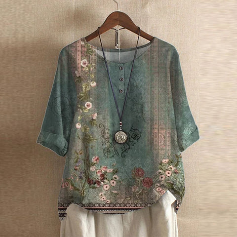 Women’s blouse in teal green with vintage floral print, short sleeves, button front