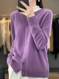 Women’s cardigan sweater, button-front knit, long sleeves, purple knit texture.