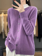 Women’s cardigan sweater, button-front knit, long sleeves, purple knit texture.