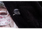 Black textured sherpa sleeveless bodywarmer with front zipper and round metal pull