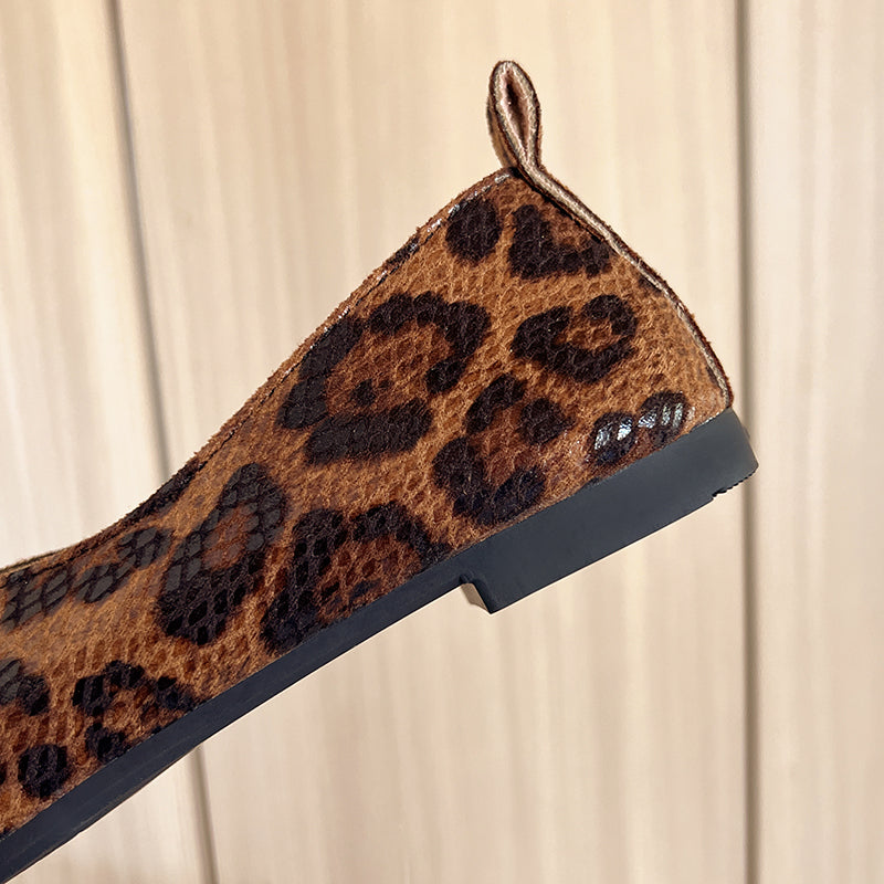 Leopard print loafer side close-up with textured sole edge and flat bottom