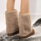 Women’s tall platform boots with plush light-brown fuzzy exterior and thick base