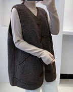 Wool gilet with button-front, dark brown sherpa fleece texture over white sleeves
