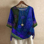 Women’s blouse in royal blue with green and purple circle prints, short sleeves, button front