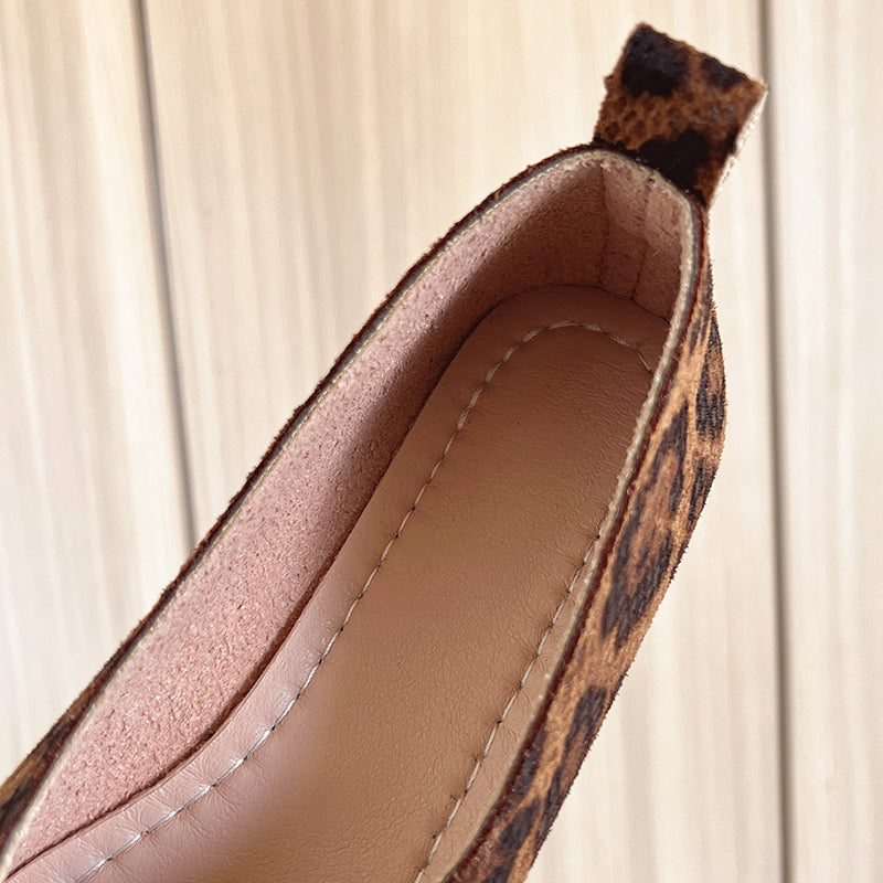 Leopard print loafer opening close-up with tan insole and stitched trim