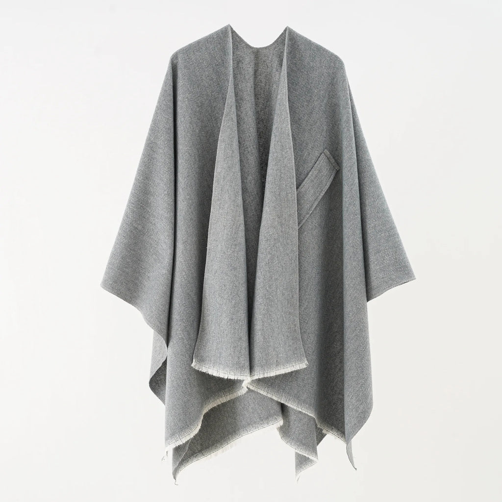 Light gray cashmere poncho with V-neck, draped sleeves, fringe hem