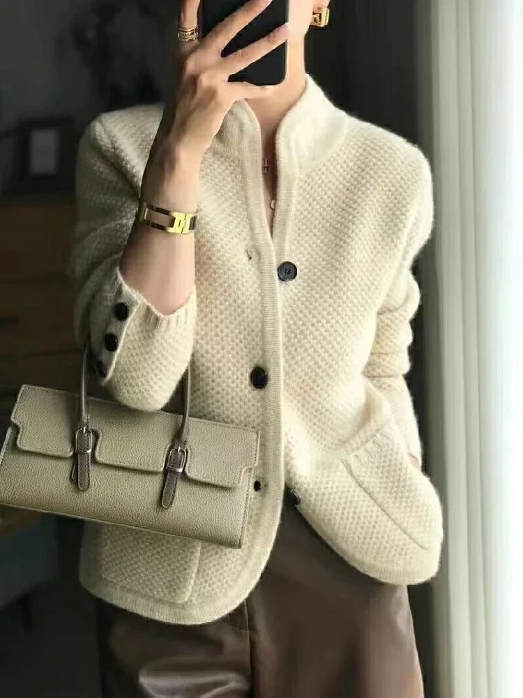 Off-white textured knit jacket with button front and stand collar
