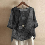 Women’s blouse in dark gray with embossed floral motifs, short sleeves, button front