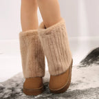 Pair of women’s tall platform boots with wide fuzzy cuffs and brown base