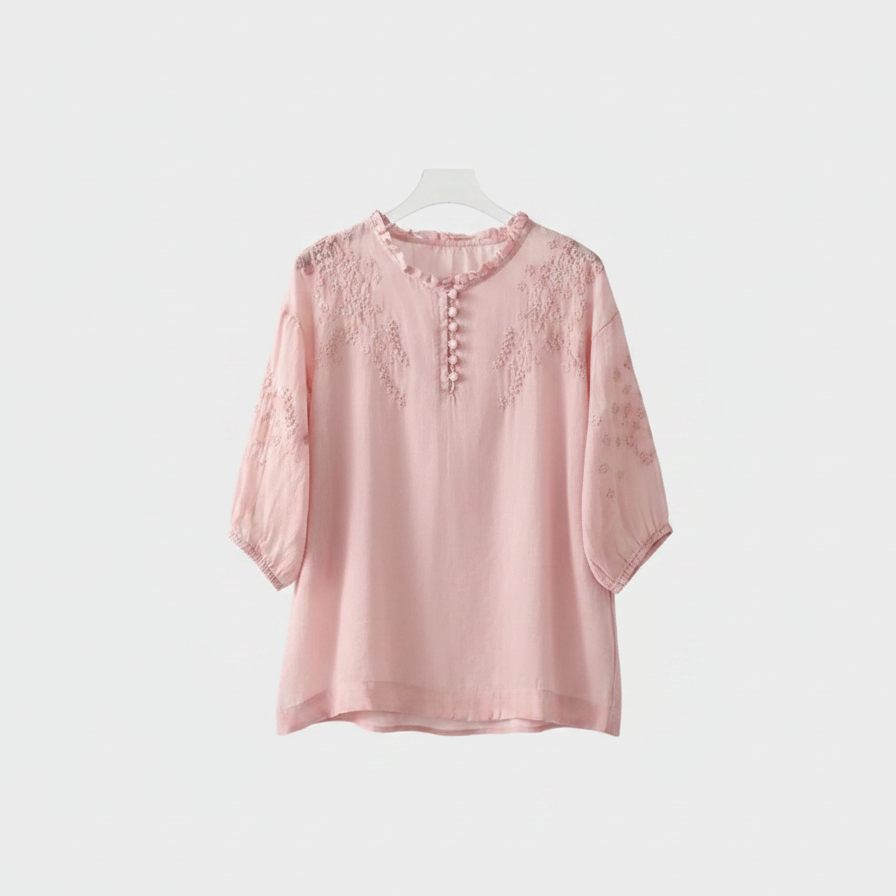 Pink embroidered blouse with ruffle neckline and half-sleeves