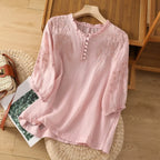 Pink embroidered relaxed blouse with half-button front and three-quarter sleeves