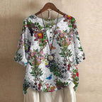 Women’s blouse in white with colorful garden floral print, short sleeves, button front