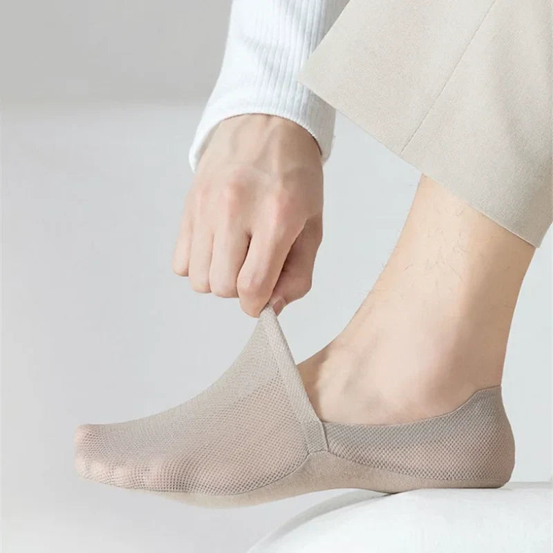 Beige no-show socks on feet, low profile ankle length