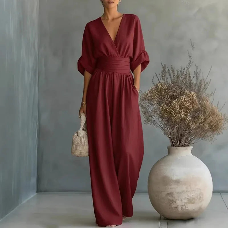 Wine red V-neck summer jumpsuit with short sleeves, cinched waist, and wide legs