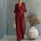 Wine red V-neck summer jumpsuit with short sleeves, cinched waist, and wide legs