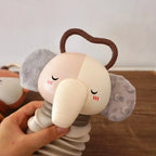 Grey and white plush animal accordion toy with curved handle and rattle coils