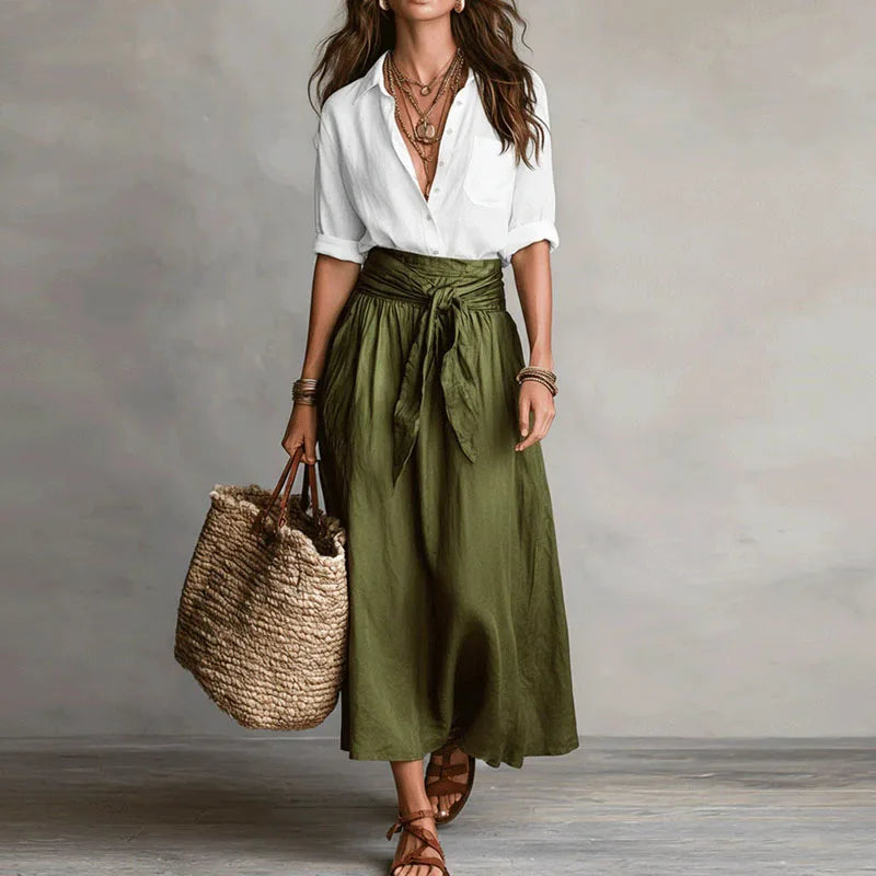 Linen co-ord set with white V-neck blouse and olive green tie-waist midi skirt