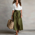 Linen co-ord set with white V-neck blouse and olive green tie-waist midi skirt