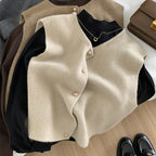 Light beige merino wool women’s vest with button-front and crew neckline