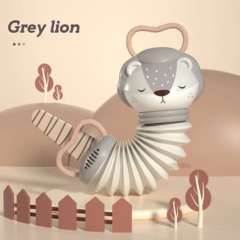 Grey animal accordion and rattle toy with handle, face details, and spring coils