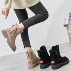Women’s ankle boots in beige and black, each with side zipper and rugged tread soles