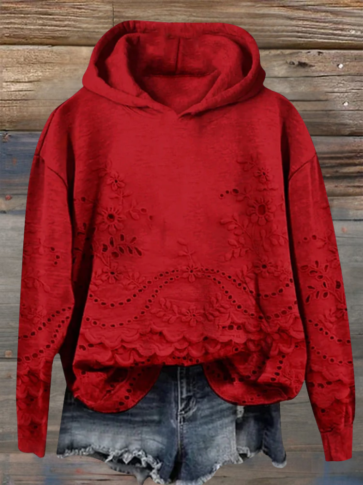 Red floral-embroidered hoodie with scalloped lace hem.