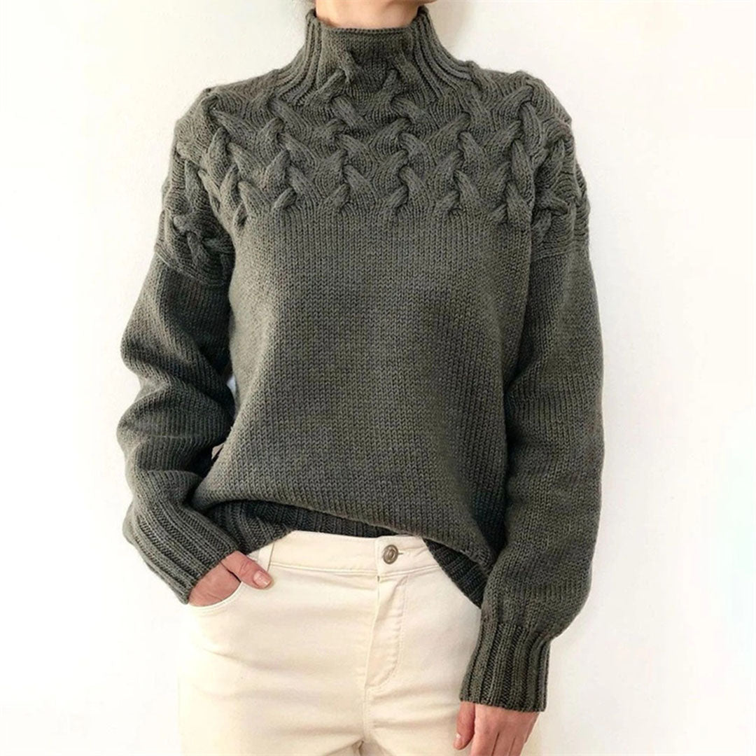 Gray women's knit turtleneck sweater with raised cable-knit detail, long sleeves