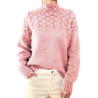 Pink women's knit turtleneck sweater with raised cable-knit detail, long sleeves