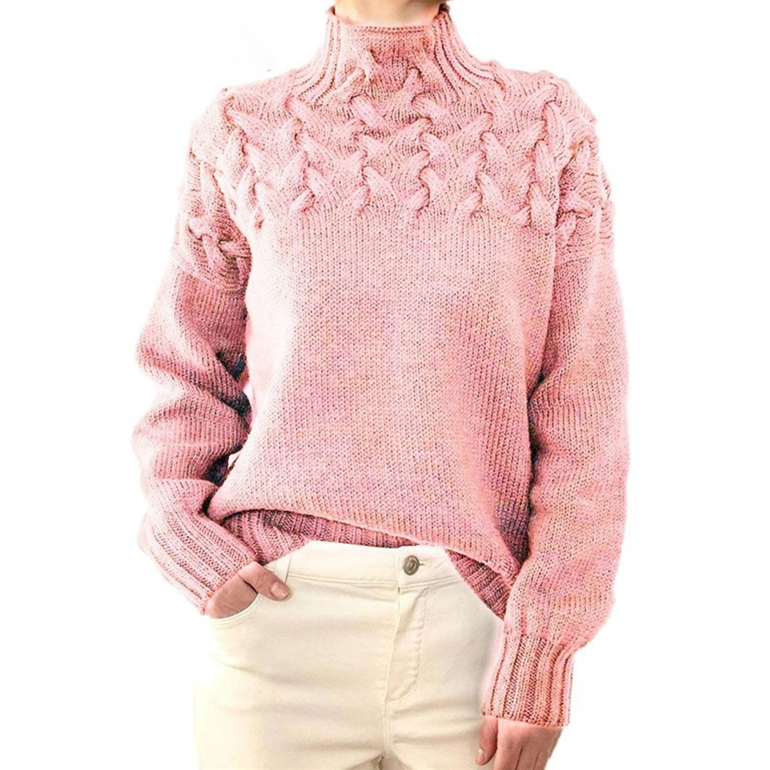 Pink women's knit turtleneck sweater with raised cable-knit detail, long sleeves