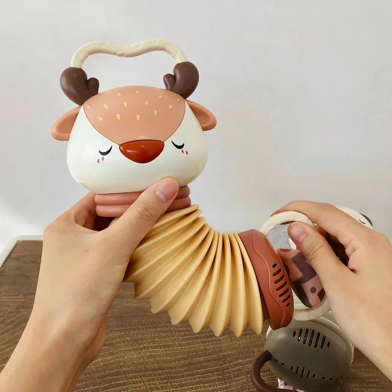 Orange-and-cream animal accordion and rattle toy with handle and plush ears
