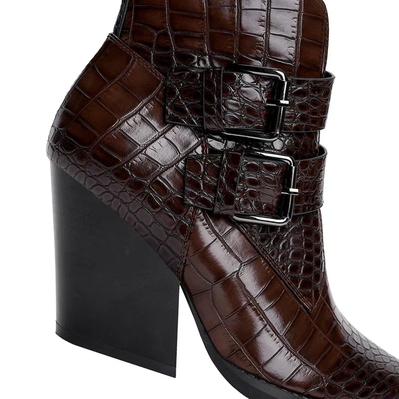 Brown pointed-toe ankle boot with side buckle straps and thick block heel