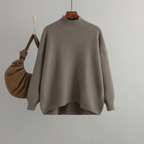 Gray knit women's sweater with crew neck and ribbed cuffs, loose drape fit