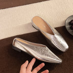 Silver slip-on flats with almond toe and supportive sole