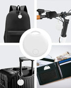 White round GPS tracker with keyring loop and central button, shown in use