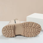 Beige women’s ankle boots—view of tread outsole and heel for grip