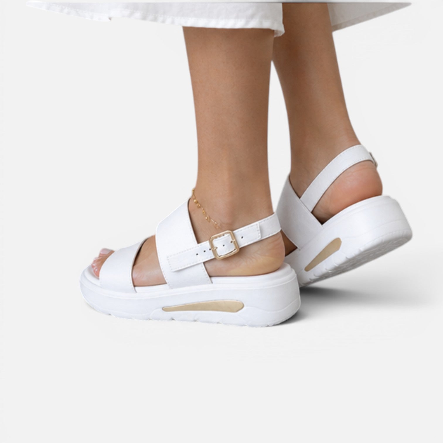 White platform sandals showing adjustable buckle on top strap and thick sole