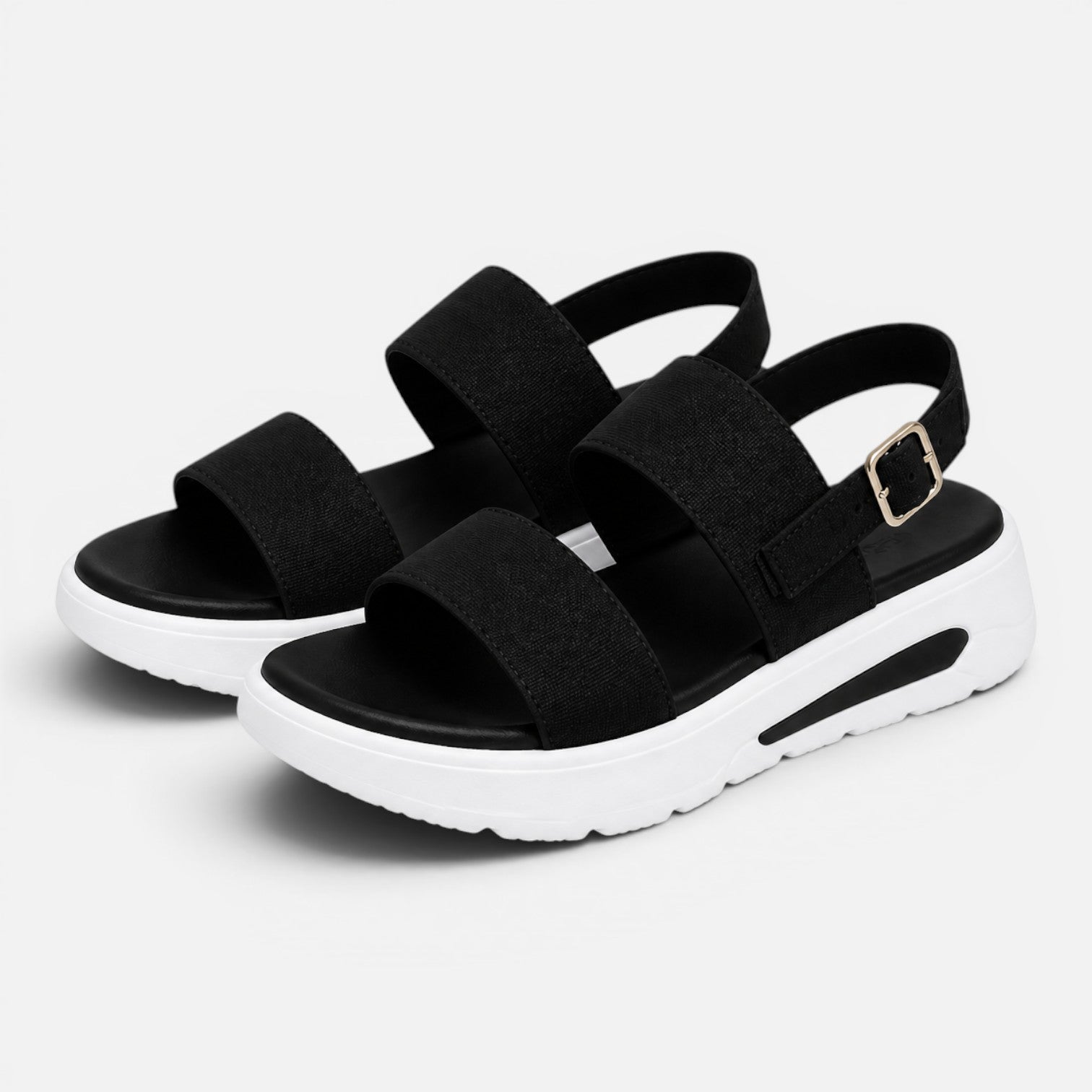 Pair of black platform sandals with wide straps, adjustable buckle, and thick sole