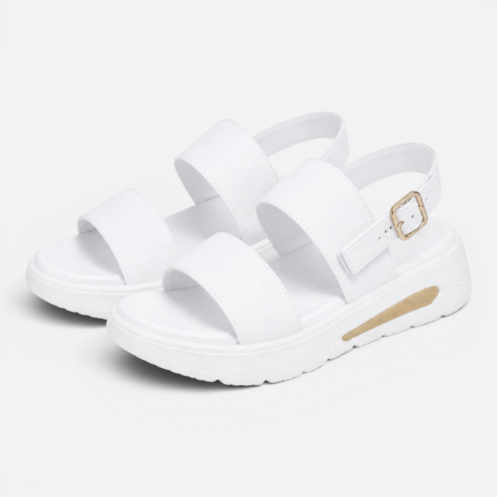 Pair of white platform sandals with wide cross straps and adjustable buckle
