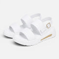 Pair of white platform sandals with wide cross straps and adjustable buckle