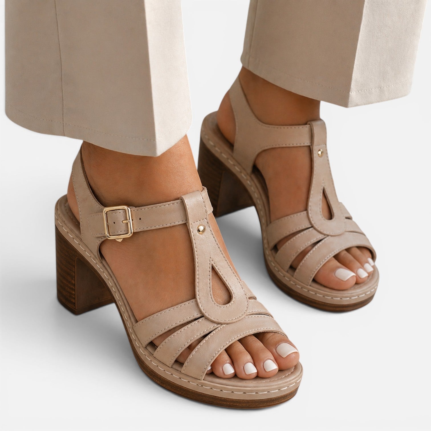 Beige block heel sandals with adjustable ankle strap and cutout toe straps