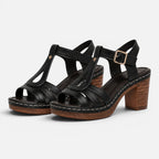 Black block heel sandals with ankle buckle and crisscross straps
