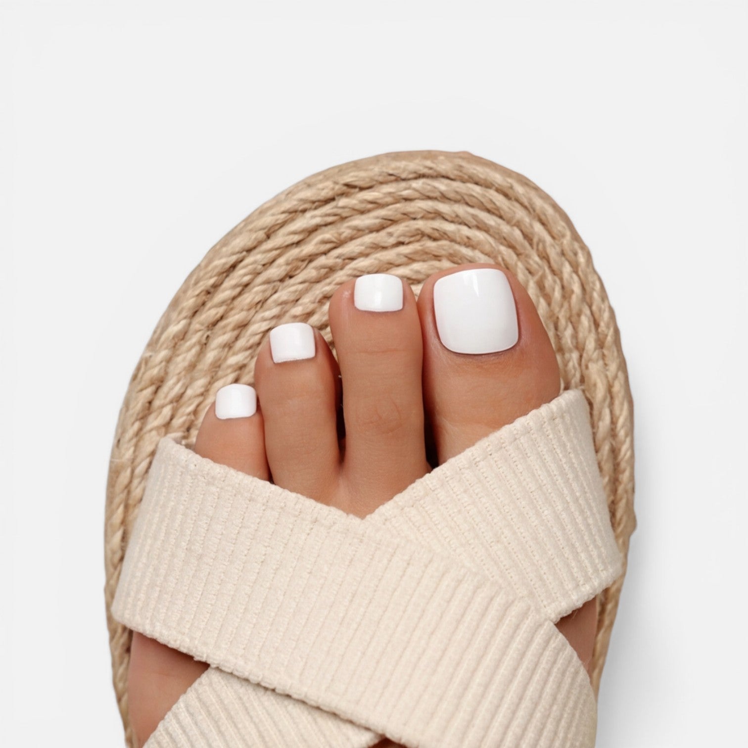 Beige cross-strap espadrille slide sandals with ribbed fabric upper and open toe