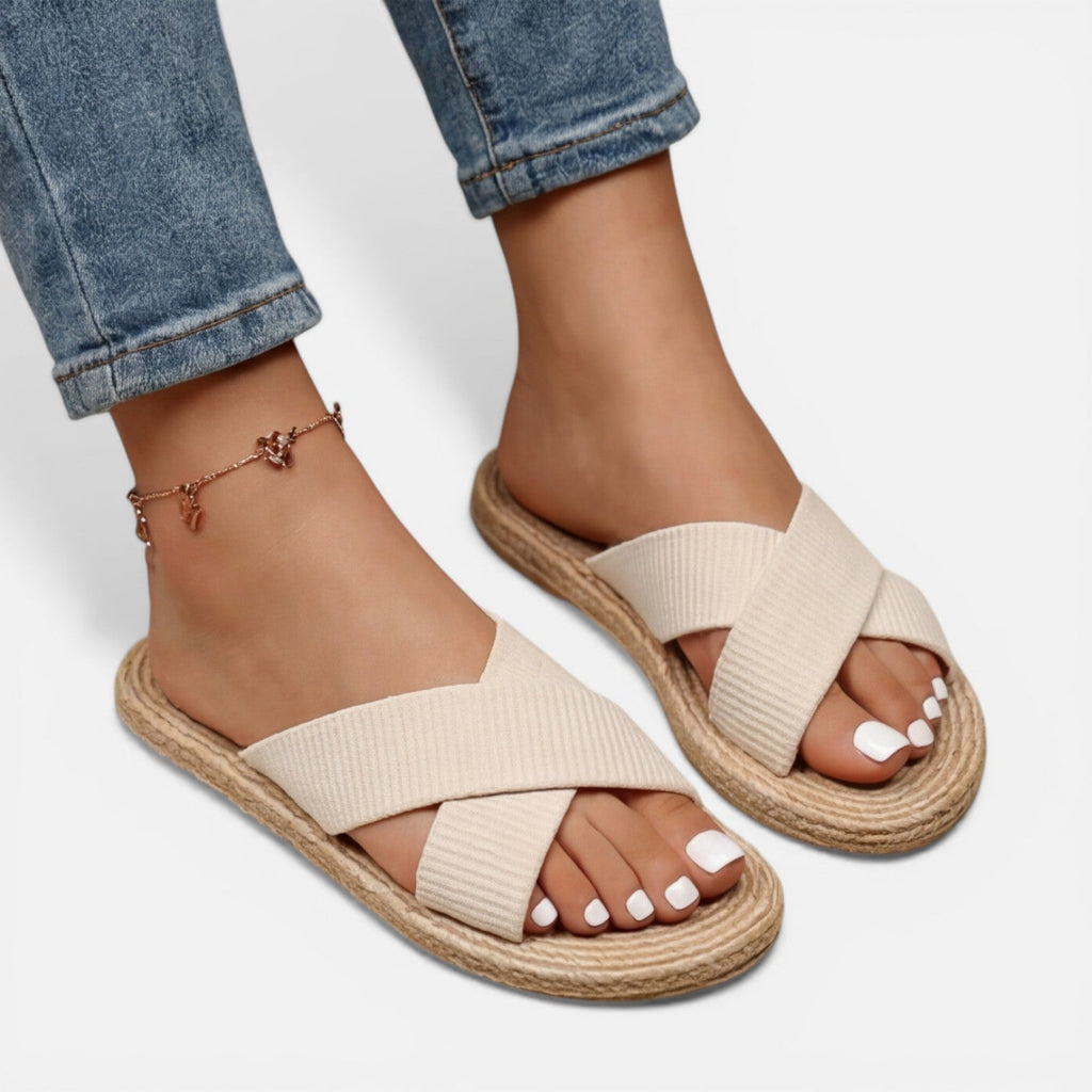 Women’s beige cross-strap espadrille slide sandals with ankle charm bracelet