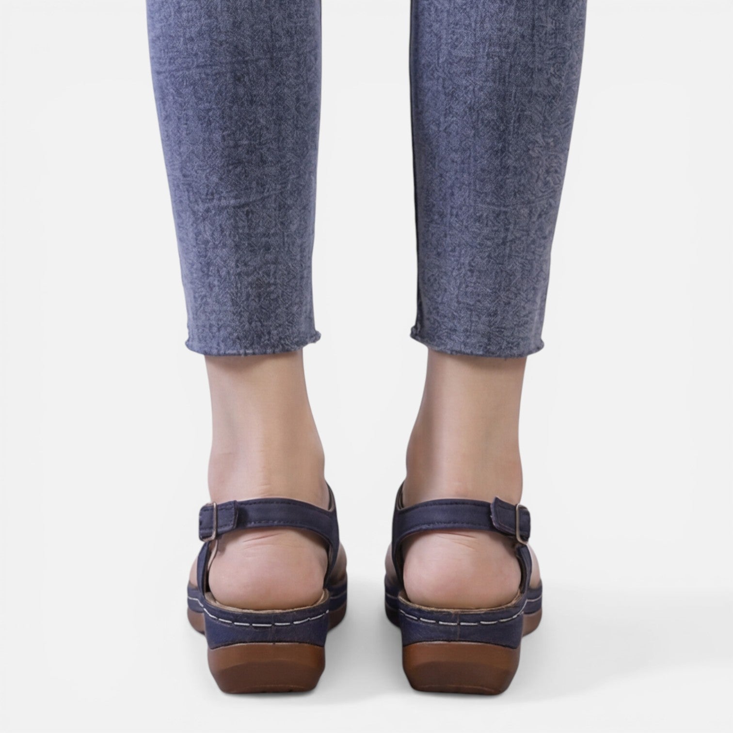 Women’s navy wedge sandals, back view with adjustable buckle straps